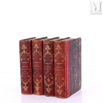 three books sitting on top of each other on a white surface