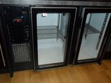 two glass doors that are open in a kitchen