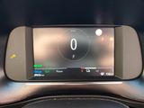 the dashboard of a car with a digital display on it