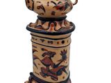 an image of a ceramic teapot with a bird design on it