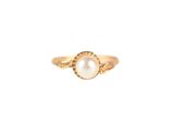 a gold ring with a pearl in the center