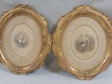 two framed pictures of a man and a woman in a gold frame