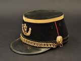 a black hat with a gold chain around the brim