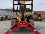 an image of a red forklift parked in a parking lot