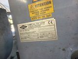 a sign on the side of a machine that says attention
