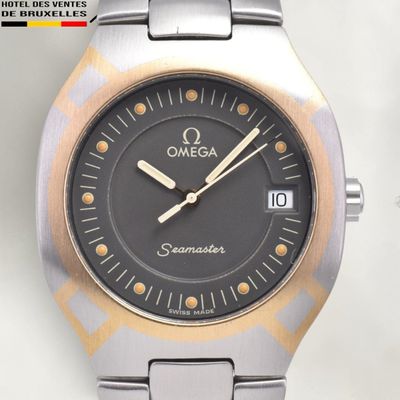 a close up of a watch on a white surface