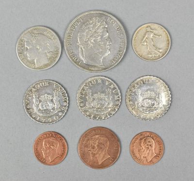 six different coins are shown in a row on a gray surface