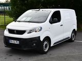 a white van that is parked in a parking lot