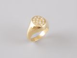 a gold signet ring with diamonds on a white background
