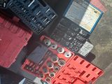 a pile of tools sitting on the ground next to each other
