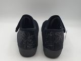a pair of black sued shoes with a star design on the sole