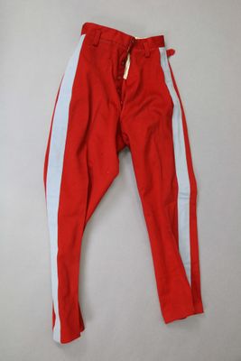a pair of red and white pants hanging on a wall