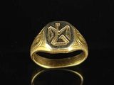 an image of a gold ring with a cross on it