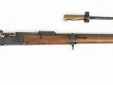 a rifle and a knife on a white background