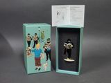 the figurine is in the box with the box open