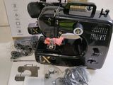 an image of a black sewing machine sitting on top of a table