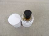 a jar with a black lid and a white jar with a black lid