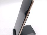 a cell phone that is sitting on top of a stand