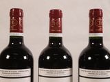 three bottles of wine sitting next to each other on a table