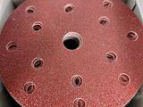 an image of a red disc in a box with holes in it