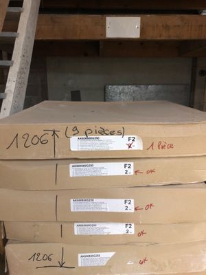several boxes stacked on top of each other in a warehouse