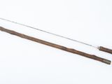 an image of a pair of canes and a stick on a white surface