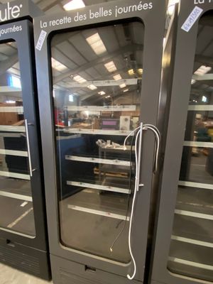 two large glass doors that are open in a store
