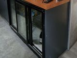 a bar with a lot of bottles on top of it