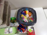 a plastic container with a stuffed animal inside of it