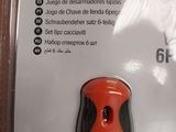 an orange and black object in a package on a table