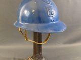 a blue helmet that is on top of a table