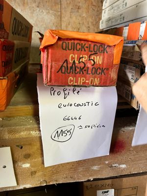 a sign on a shelf that says quicklock clock club on it