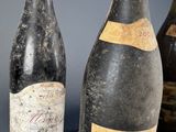 three bottles of wine sitting next to each other on a table
