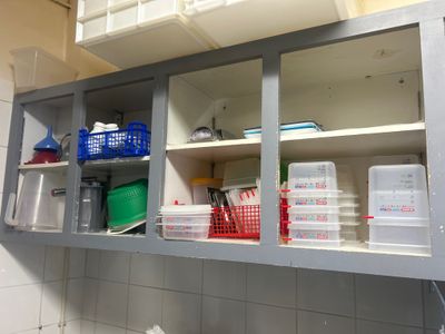 many containers and containers on the shelves in the kitchen