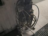 a machine that is sitting on the side of a building