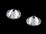 a pair of clear crystals on a black background