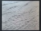 an image of a black and white photo of sand in a black frame