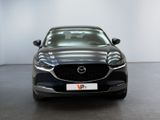 the mazda cx - 5 is parked in a showroom