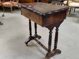 a small table with a wooden top in a room