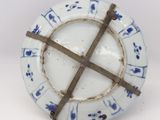 a white plate with blue and white designs on it