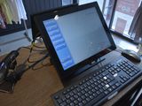 a laptop computer sitting on a desk with a keyboard and mouse