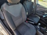 the interior of a car with two seats and a steering wheel