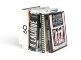livres empilés sur une surface blanche