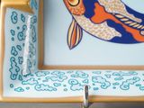 a small plate with a fish design on it