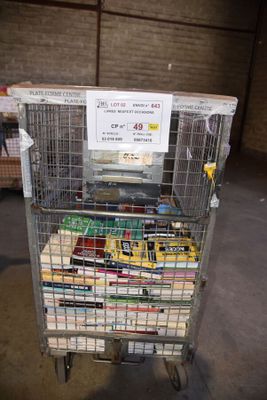 a metal cart with a bunch of books in it
