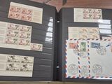 an open book with a bunch of stamps on it sitting on top of a table