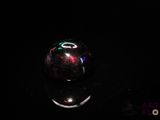 an image of a glass ball in the dark
