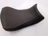 a close up of a motorcycle seat on a white surface