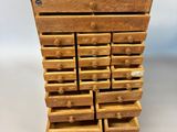 a stack of wooden drawers are stacked on top of each other