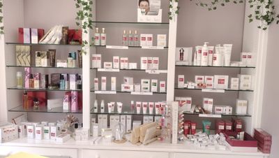 a display of cosmetics products on a shelf in a store